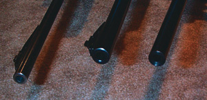 The rifle on top has almost all of the blueing burned off as a result of a lot of firings. A rifle muzzle appearing like this could have seen a lot of actual use, while the other two rifles seem to show very little sign of actual firings.